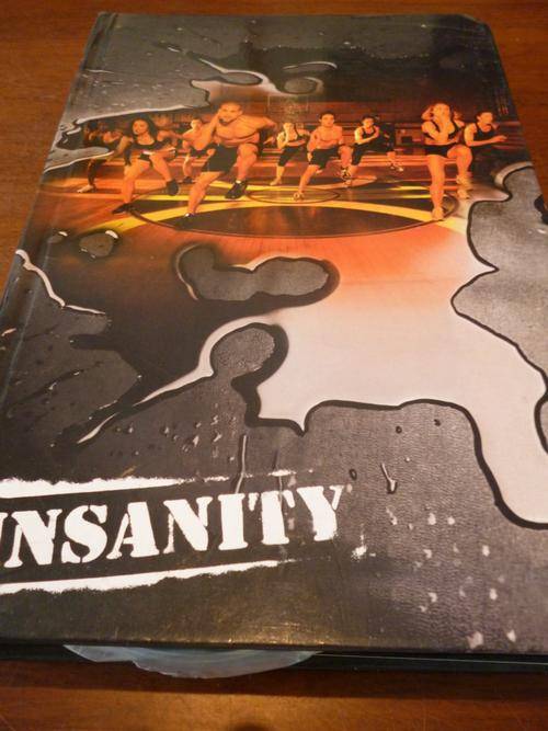 INSANITY 10 BRAND NEW DVD SET WITH NUTRITION BOOK AND CALENDAR COMPLETE.